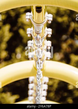 chains on swing set at public playground Stock Photo