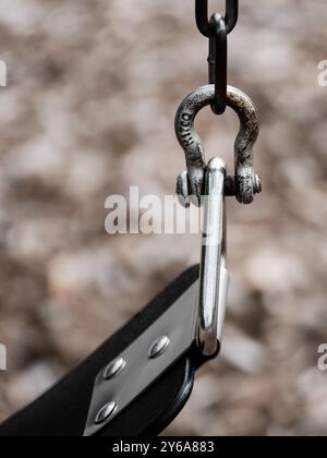 chain swing on public playground in park Stock Photo