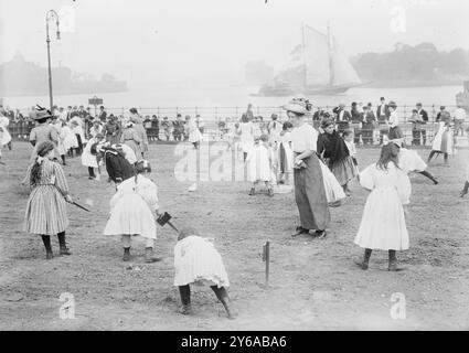 Farm for school children, N.Y.C., Photograph shows children in the farm garden which opened on May 20, 1911 and was designed as a place of respite for child laborers in Thomas Jefferson Park, New York City., between ca. 1910 and ca. 1915, N.Y.C, Children, Glass negatives, 1 negative: glass; 5 x 7 in. or smaller. Stock Photo