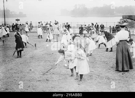 Farm for children, N.Y.C., Photograph shows children in the farm garden which opened on May 20, 1911 and was designed as a place of respite for child laborers in Thomas Jefferson Park, New York City., between ca. 1910 and ca. 1915, N.Y.C, Children, Glass negatives, 1 negative: glass; 5 x 7 in. or smaller. Stock Photo