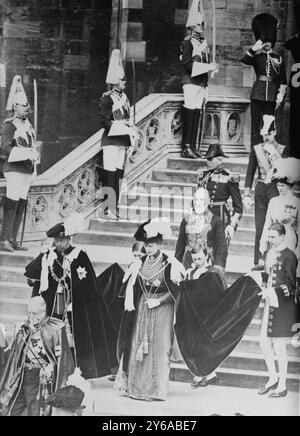 King and Queen leaving St. George's Chapel, Photo shows the soon-to-be King of England, George V, and his wife Mary of Teck leaving the St. George's Chapel at Windsor Castle after the Prince of Wales (the future Edward VIII) was invested with the Order of the Garter. This event was one of several state functions leading up to George V's coronation on June 22, 1911, at Westminster Abbey., 1911 June 10, Glass negatives, 1 negative: glass; 5 x 7 in. or smaller. Stock Photo