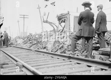 Car Chisholm i.e., Chrisholm, Photograph shows people looking at wrecked railroad cars after a railroad accident in which the White Mountain Express crashed through two cars of the Bar Harbor Express, north of New Haven, Connecticut on Sept. 2, 1913., 1913 Sept. 2, Glass negatives, 1 negative: glass; 5 x 7 in. or smaller. Stock Photo