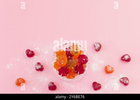 Yummy jelly candies on pink background. Stock Photo