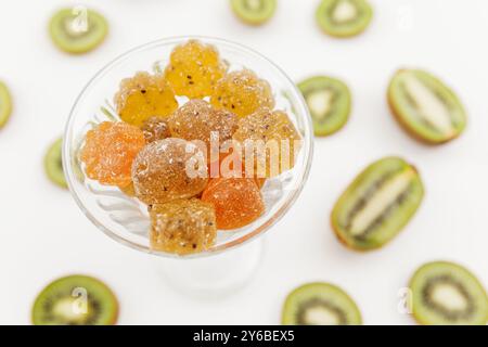 Sweet fruit jelly with kiwi fruits on white. Stock Photo