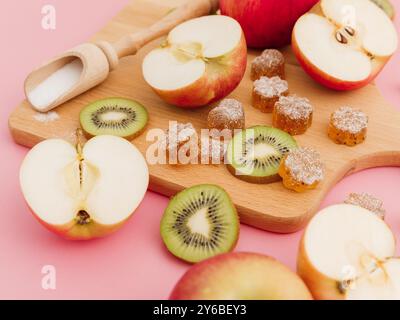 Homemade marmalade with sweet apple and kiwi fruits on white. Flat lay, top view Stock Photo