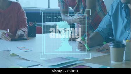 Image of portrait scans processing over diverse designers at design meeting Stock Photo
