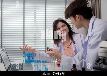 Engaged Scientists Discussing Experimental Data for Advancing Research Projects Stock Photo