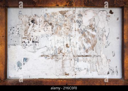 Old advertising board with rusty frame background Stock Photo