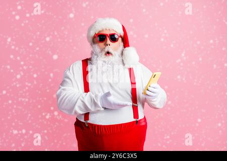 Portrait of his he nice attractive amazed stunned bearded fat guy Santa using gadget browsing post social network blog comment feedback reaction Stock Photo