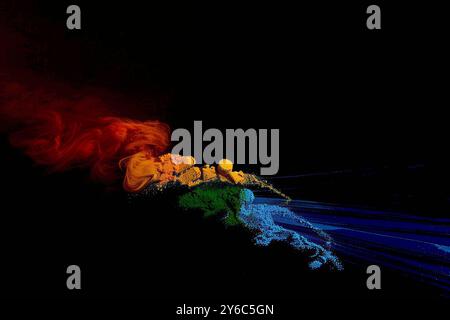 Vibrant abstract background featuring colorful powdery textures on a dark canvas Stock Photo