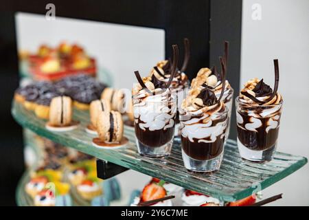 Different types of sweet desserts, mousses, biscuits. Candy bar mock up. Soft focus Stock Photo