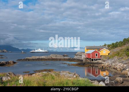 Traditional fishermen's houses, called rorbuer, on rocky coast of Vestfjord, Sorvagen, Lofoten, Norway, Europe Stock Photo