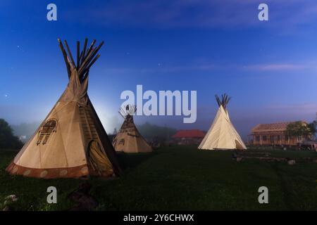 Native American Day. Tipi, tepee camping at night Stock Photo