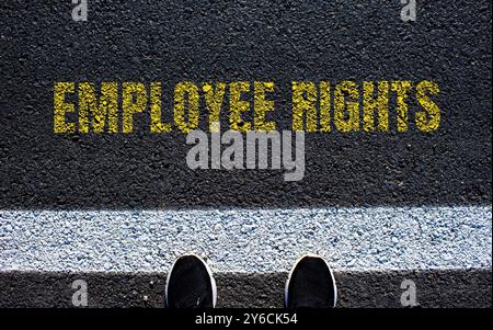 Employee rights message written on ripped torn paper with blue ...