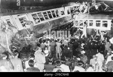 RAIL CRASHES COMMUTER TRAIN COLLIDED FREIGHT TRAIN IN YOKOHAMA,  JAPAN  ;  10 NOVEMBER 1963 Stock Photo