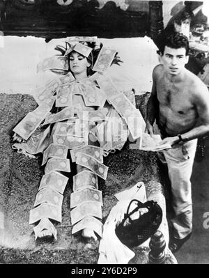 ACTRESS CATHERINE SPAAK COVERED WITH MONEY BANK NOTES IN ROME, ITALY