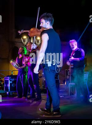 Mauro Durante and his band Canzoniere Grecanico Salentino, or CGS, perform in Alessano, Lecce Province, Apulia, Italy. The band perform pizzica, or Sa Stock Photo