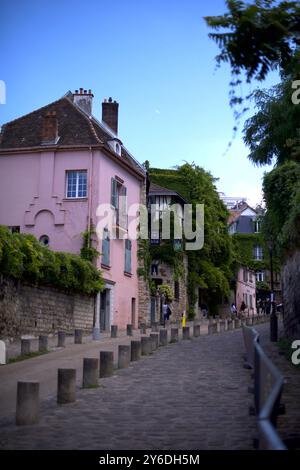 Montmartre street with pink houses Stock Photo