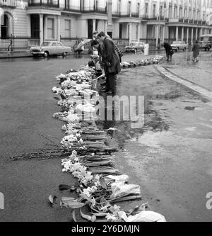 20 APRIL 1963 - - FLOWERS AND A SILENT PROTEST AT THE SPANISH EMBASSY IN BELGRAVE SQUARE, FOLLOWING THE EXECUTION OF SPANISH COMMUNIST LEADER JULIAN GRIMAU. LONDON, ENGLAND. Stock Photo