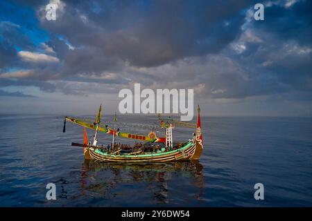 Indonesia, Bali island, Perancak village, richly decorated fishing boat fishing at sea Stock Photo