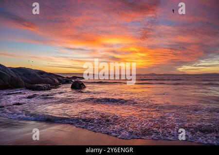 Afterglow Over Langebaan, A Symphony of Pinks, oranges, and Reflected Warmth Stock Photo