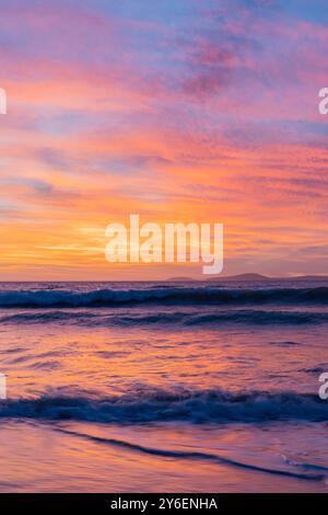 Afterglow Over Langebaan, A Symphony of Pinks, Reds, and Reflected Warmth Stock Photo