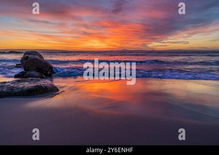 Afterglow Over Langebaan—A Symphony of Pinks, Reds, and Reflected Warmth Stock Photo