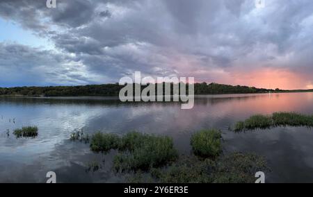 Cloudy Sunset Over an Lake Olathe Kansas Public Park Stock Photo