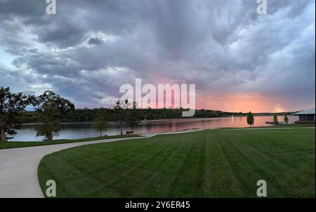 Cloudy Sunset Over an Lake Olathe Kansas Public Park Stock Photo