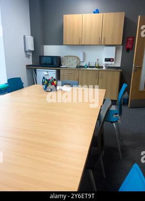 Conference meeting room table staffroom in school with kitchen Stock Photo