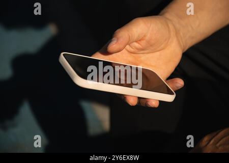 Male hand using mobile phone. Close up Stock Photo