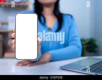 Businesswoman hand holding smartphone with white empty screen in hand, Smartphone mockup for online shopping, Online education or online business with Stock Photo