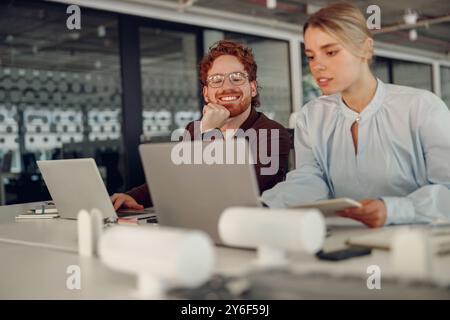 Engaging in Collaborative Work within the Dynamics of a Modern Office Environment Stock Photo