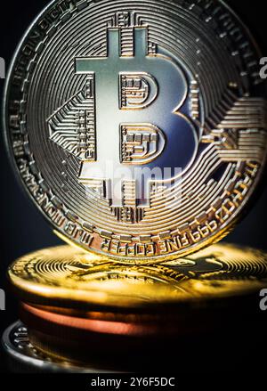 Stack of silver and gold bitcoins with golden bitcoin standing on the top. Stack of cryptocurrency, business concept Stock Photo
