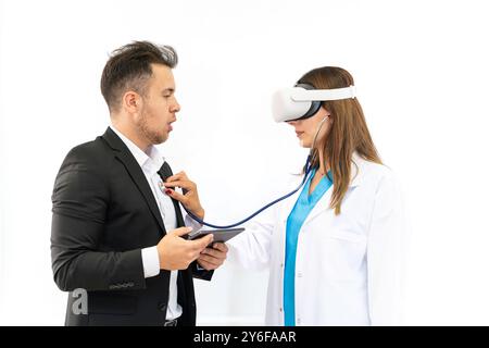 Doctor and patient discussing something while wearing virtual reality glasses. Healthcare and medical concept. Stock Photo