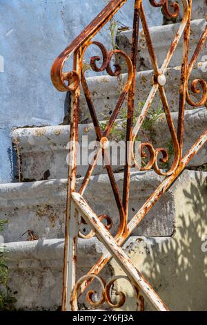 Rust Guardrails A steep flight of stone steps on a walking trail, surrounded by lush ...