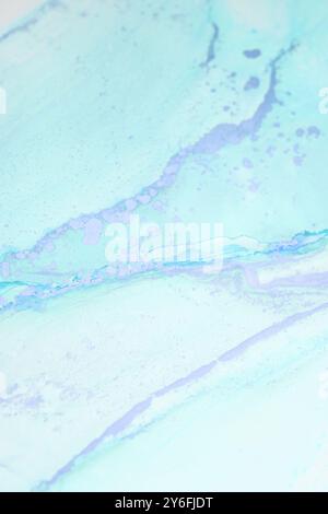 Delicate blue abstract artwork featuring soft swirls and streaks of color on a light background in natural lighting Stock Photo