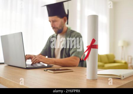 Online learning and teaching marketplace, graduation scroll close up, diploma certificate rolled  Stock Photo