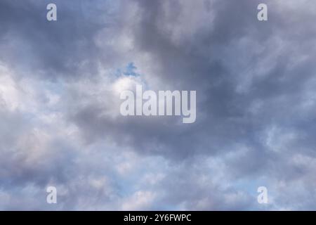 Grey stratocumulus clouds covering blue sky, Finland Stock Photo