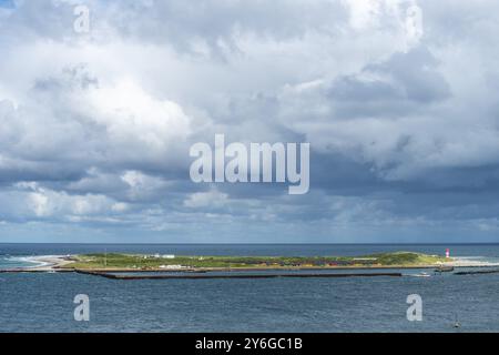 Dune of the offshore island Helgoland, south beach with lighthouse, west pier with dune ferry, cloudy sky, sunshine, North Sea, district Pinneberg, Sc Stock Photo