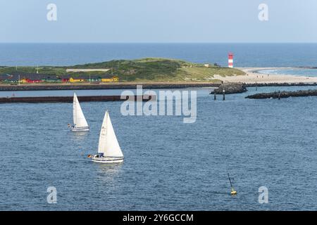 South beach with lighthouse, dune of the offshore island of Heligoland, dune village bungalow, sailing boats, North Sea, Pinneberg district, Schleswig Stock Photo