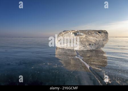 Frozen Lake Baikal landscape, sunlight is refracted in piece of ice Stock Photo