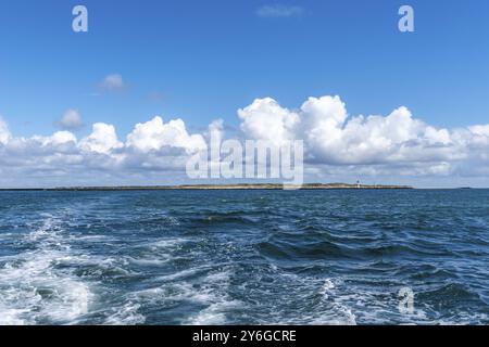 Dune of the high sea island Helgoland, south beach with lighthouse, swell, cloudy sky, sunshine, North Sea, district Pinneberg, Schleswig-Holstein, Ge Stock Photo