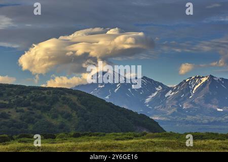 Dramatic spectacular lenticular cloud formation over volcano on Kamchatka peninsula, Russia, Europe Stock Photo