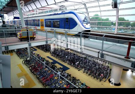 Bicycle storage area at a railway station in Houten, a Dutch new town near Utrecht. Stock Photo