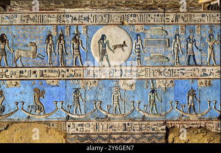 Hieroglyphic carvings and paintings on the interior walls of an ancient egyptian temple in Dendera Stock Photo