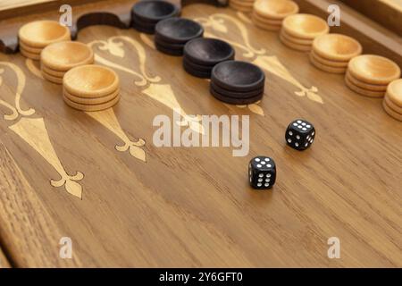 Dice on a backgammon board close-up Stock Photo