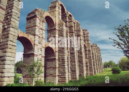 The Acueducto de los Milagros English: Miraculous Aqueduct is the ruins of a Roman aqueduct bridge, part of the aqueduct built Stock Photo