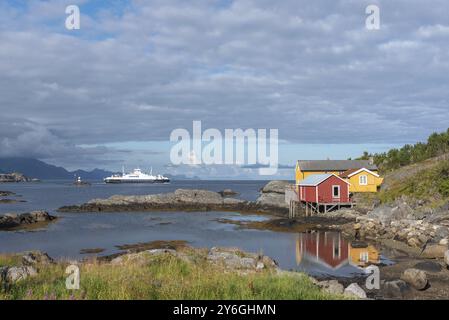 Traditional fishermen's houses, called rorbuer, on the rocky coast of the Vestfjord, Sorvagen, Lofoten, Norway, Europe Stock Photo