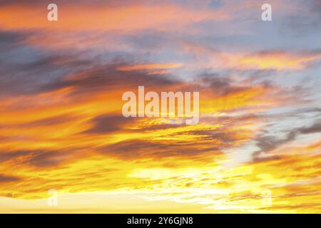 Dramatic yellow and orange colored sunset cloudscape for background or sky replacement photo editing. Beauty in nature Stock Photo